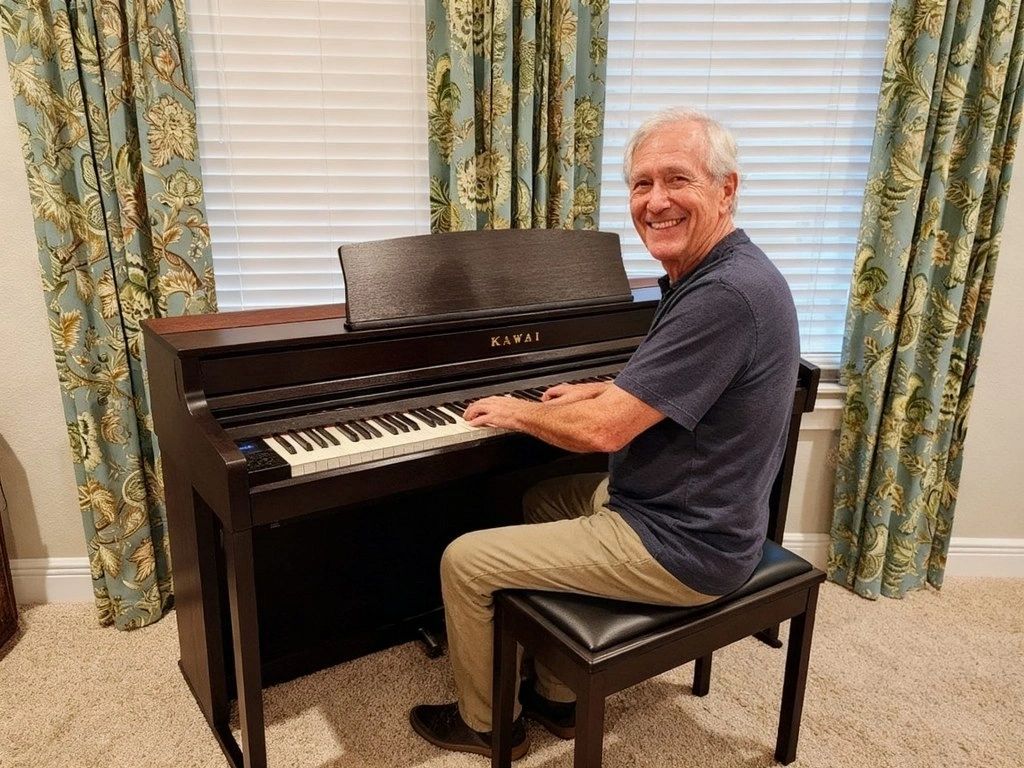 Happy adult playing his Kawai CA501 digital piano